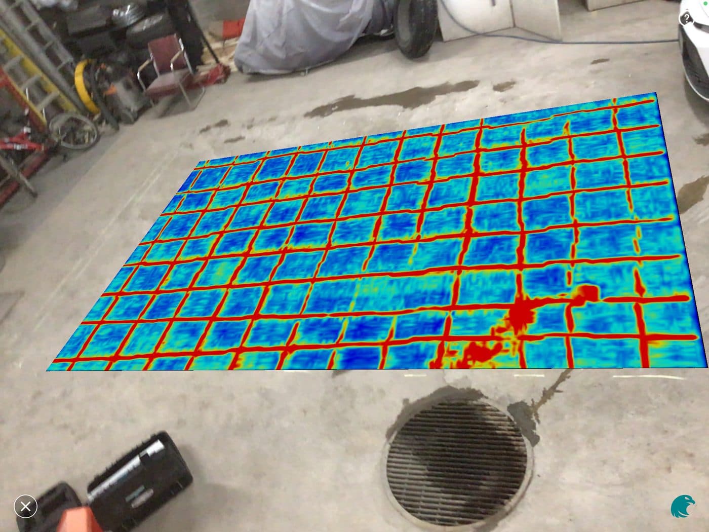 Technician scanning a concrete floor with a Proceq GP8000 while an iPad shows the live GPR app